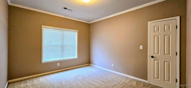 carpeted spare room with ornamental molding