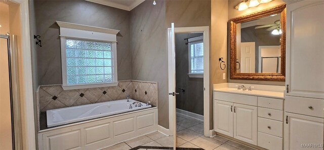 bathroom featuring a bath, ornamental molding, tile patterned flooring, vanity, and ceiling fan