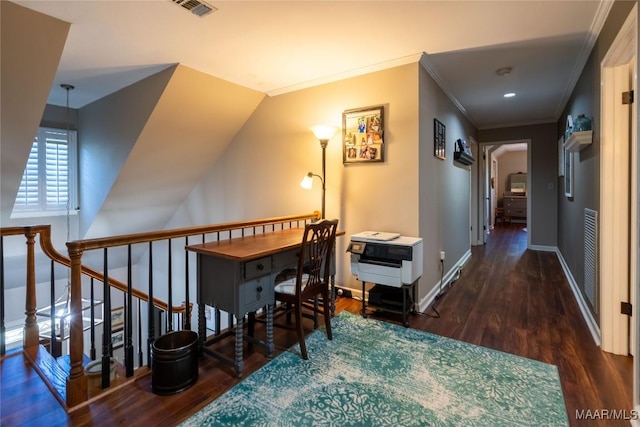 hallway featuring baseboards, visible vents, ornamental molding, wood finished floors, and an upstairs landing