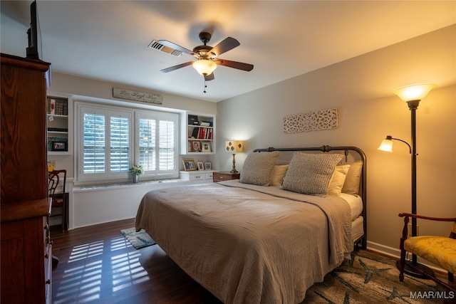 bedroom featuring ceiling fan and dark hardwood / wood-style floors