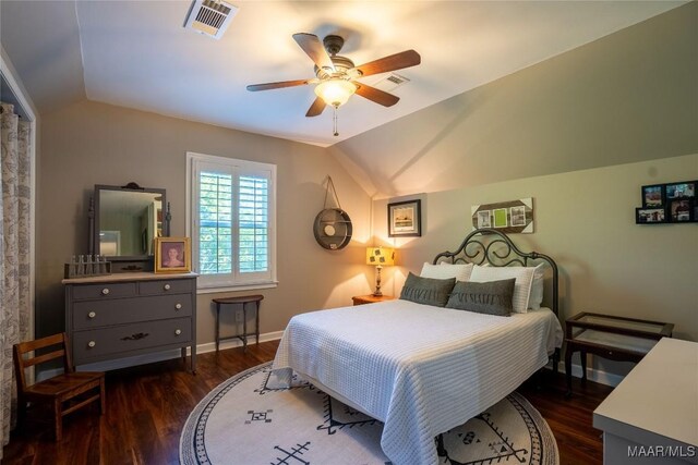 bedroom with ceiling fan, dark hardwood / wood-style flooring, and lofted ceiling