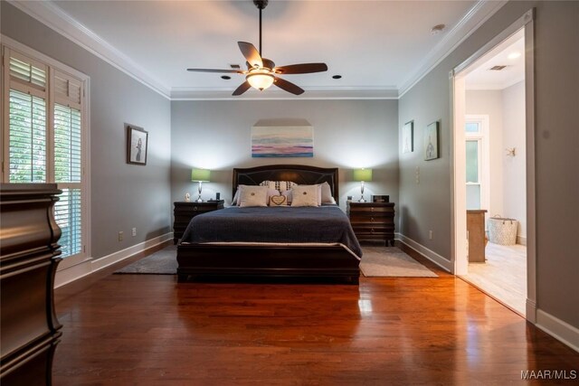 bedroom featuring hardwood / wood-style floors, ornamental molding, and ceiling fan