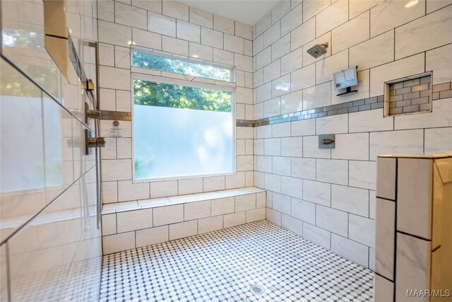 bathroom with a tile shower