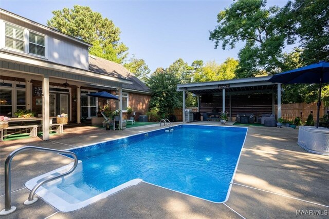 view of swimming pool with a patio area