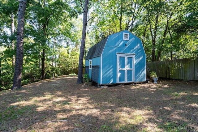 view of shed with fence