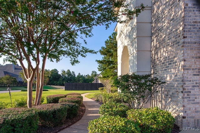 view of home's community with a lawn