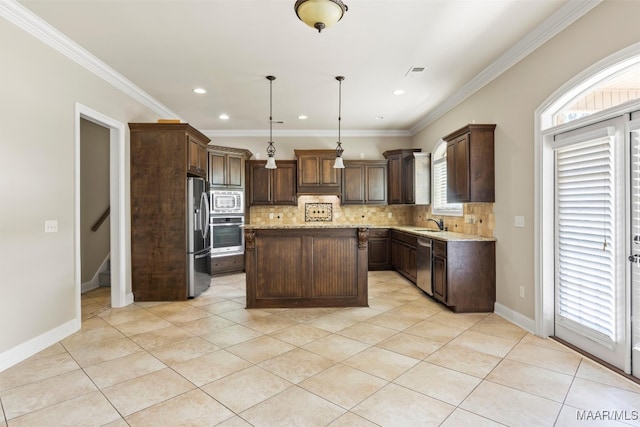 kitchen featuring stainless steel appliances, tasteful backsplash, light tile patterned floors, a kitchen island, and hanging light fixtures