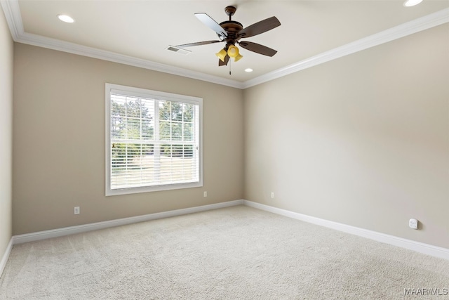 empty room with carpet, crown molding, and ceiling fan