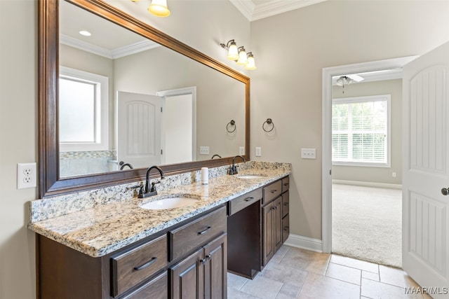 bathroom with ornamental molding, tile patterned floors, and vanity