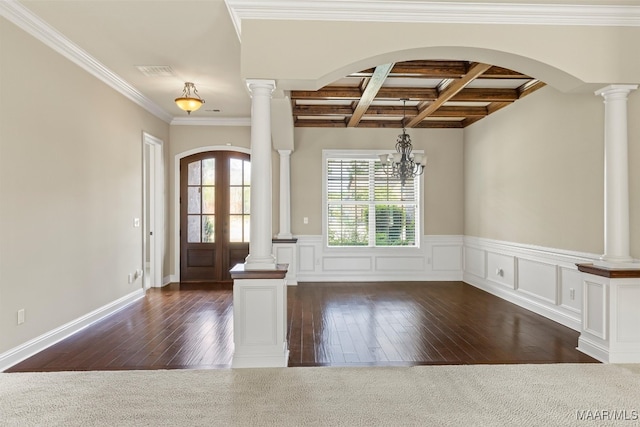 entrance foyer featuring ornate columns, a notable chandelier, ornamental molding, beamed ceiling, and coffered ceiling