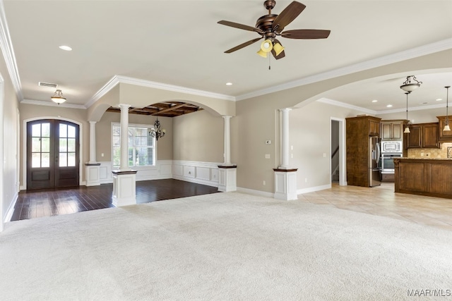 unfurnished living room with light carpet and ornamental molding