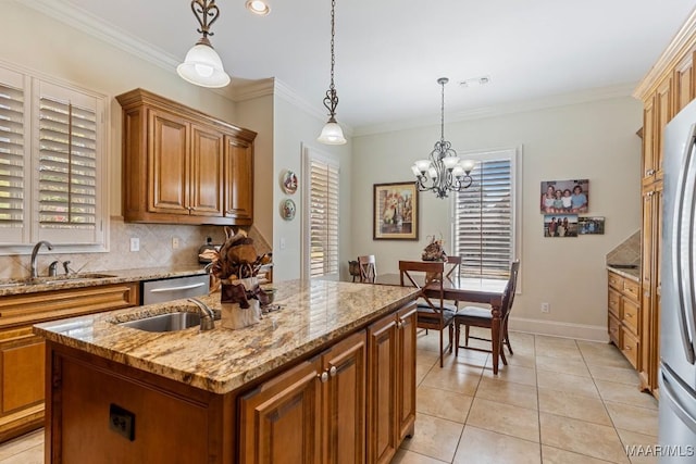 kitchen featuring a sink, ornamental molding, appliances with stainless steel finishes, brown cabinets, and decorative backsplash