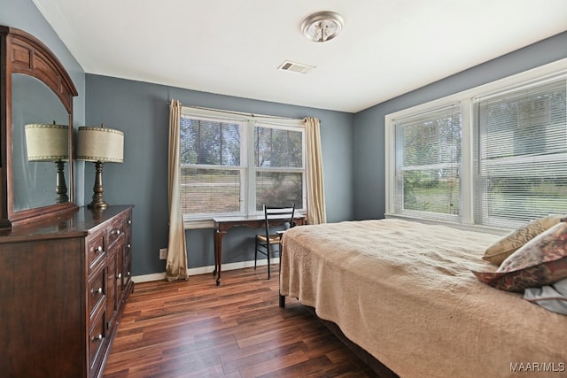 bedroom featuring dark hardwood / wood-style flooring