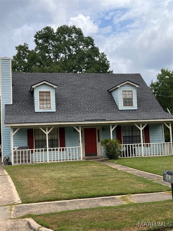 view of front of property featuring covered porch and a front lawn