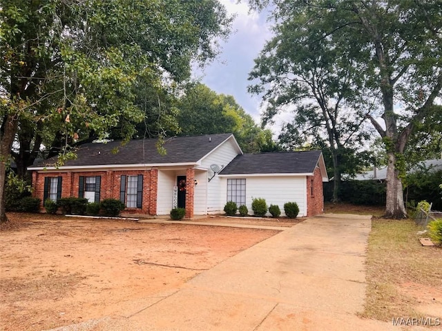 532 Lynnhurst Ct, Montgomery, AL 36117 - view of front of house featuring brick siding, concrete driveway, and roof with shingles