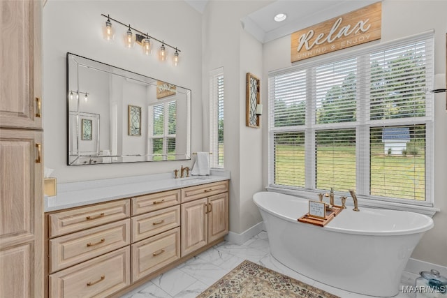 bathroom featuring a washtub, tile patterned floors, and vanity