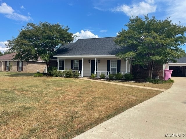 view of front of home featuring a garage and a front lawn