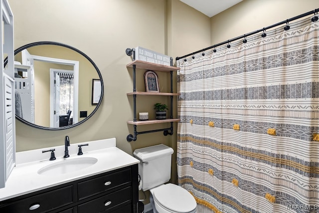 bathroom with toilet and vanity