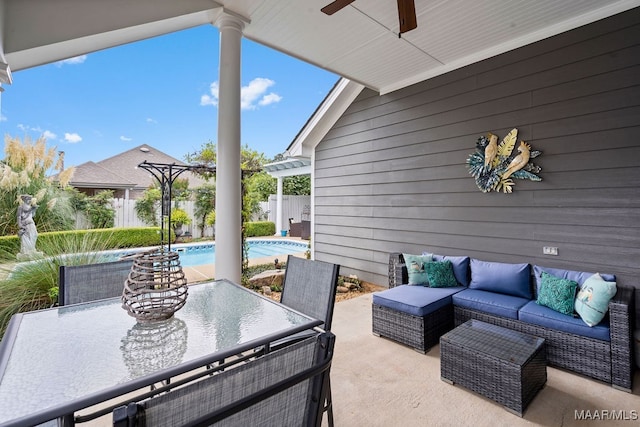 view of patio with ceiling fan, an outdoor living space, and a fenced in pool