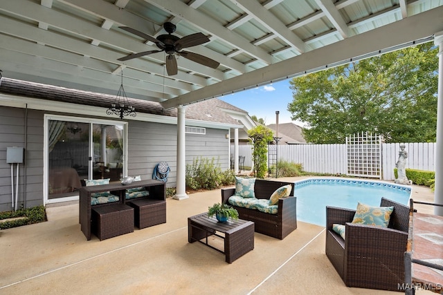 view of patio / terrace featuring ceiling fan, a fenced in pool, and an outdoor hangout area