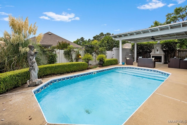 view of swimming pool with ceiling fan and a patio area