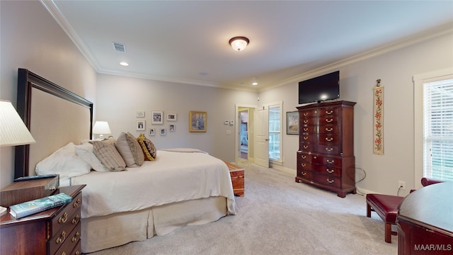 bedroom with light colored carpet and ornamental molding