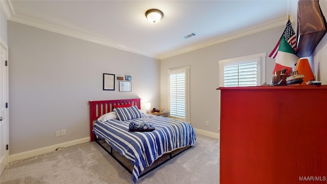 carpeted bedroom featuring crown molding