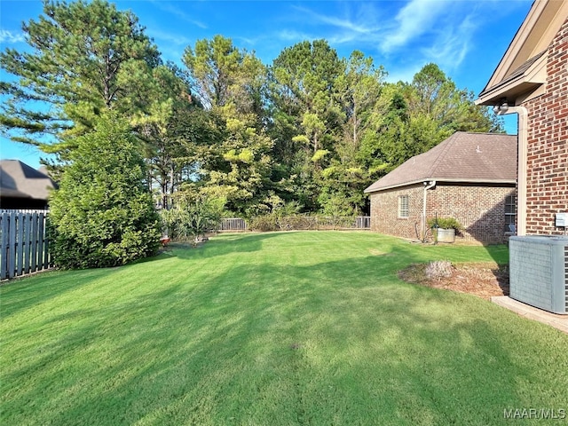 view of yard featuring central AC unit