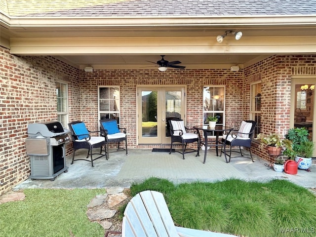 view of patio with french doors, ceiling fan, and a grill