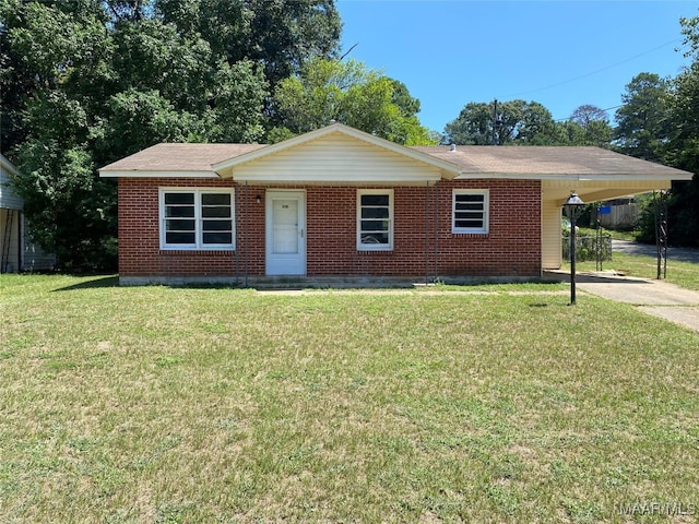 ranch-style house featuring a front yard and a carport