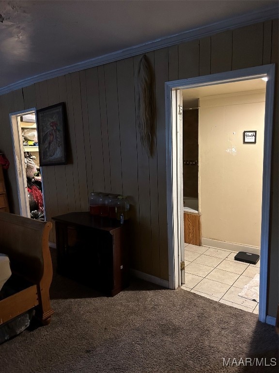 interior space featuring ornamental molding and light colored carpet