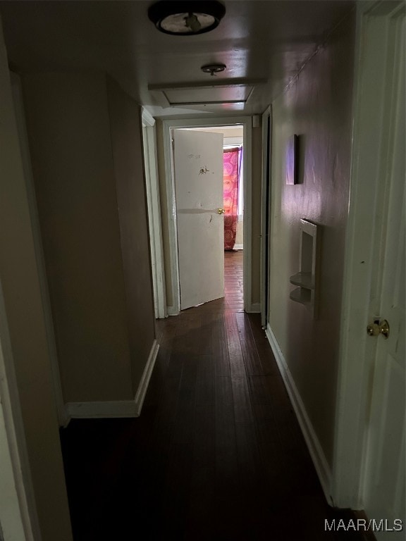 hallway with dark hardwood / wood-style floors