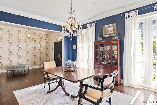 dining area featuring ornamental molding, a chandelier, and dark hardwood / wood-style floors