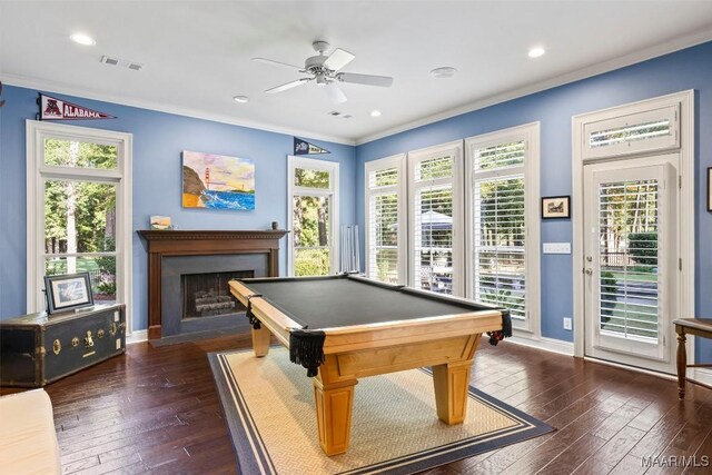 game room with dark wood-type flooring, pool table, crown molding, and ceiling fan