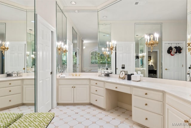 bathroom featuring tile patterned flooring, a chandelier, crown molding, and vanity