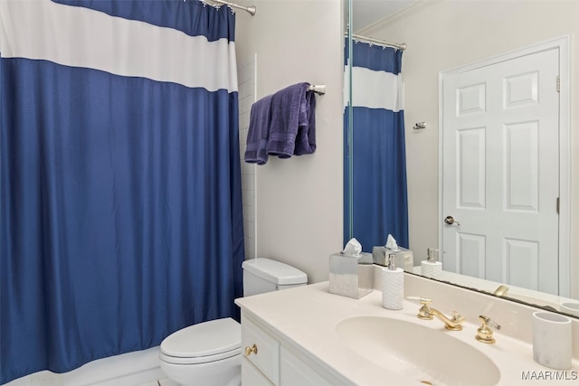 bathroom featuring ornamental molding, vanity, toilet, and curtained shower