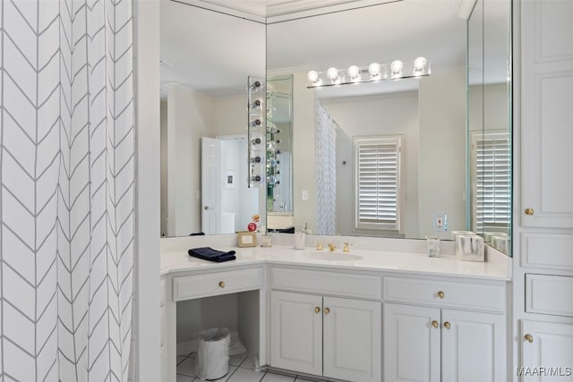 bathroom with ornamental molding, vanity, and tile patterned flooring