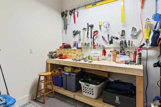 miscellaneous room featuring a workshop area