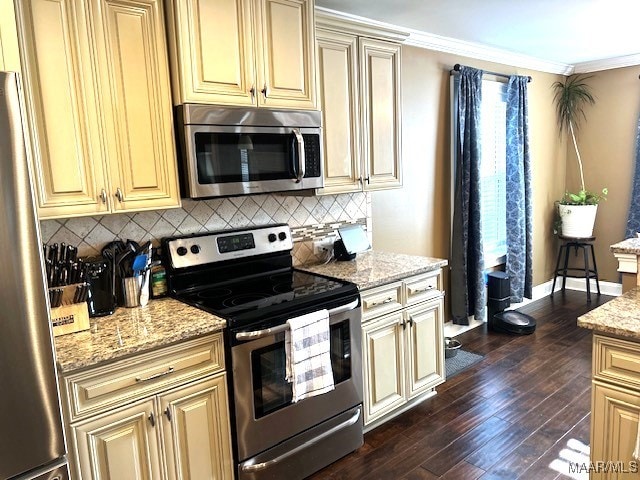 kitchen with dark wood-type flooring, stainless steel appliances, light stone countertops, and decorative backsplash