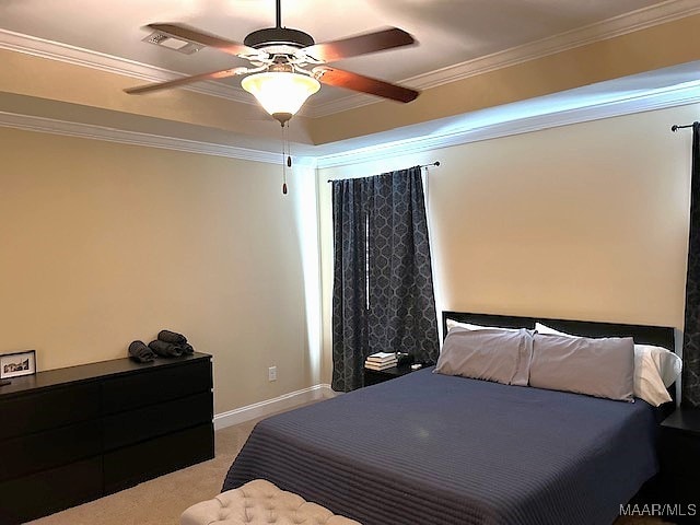 bedroom with crown molding, ceiling fan, and carpet floors