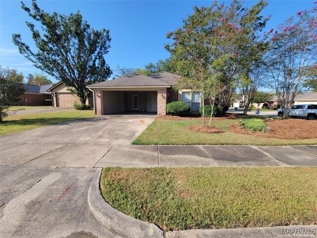 single story home with a garage, a carport, and a front lawn