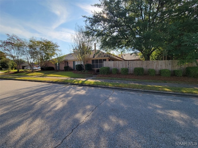 ranch-style house with a front yard