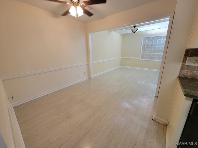 interior space with light wood-type flooring and ceiling fan