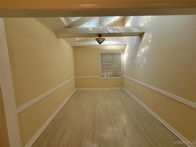 1505 Prairie Ln, Montgomery, AL 36117 - unfurnished room with vaulted ceiling with skylight, wood finished floors, and baseboards