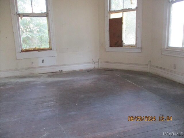 empty room with hardwood / wood-style floors