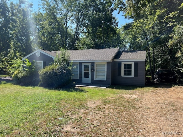 ranch-style home with a front lawn