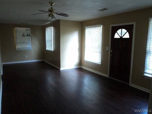 foyer with dark wood-type flooring and ceiling fan