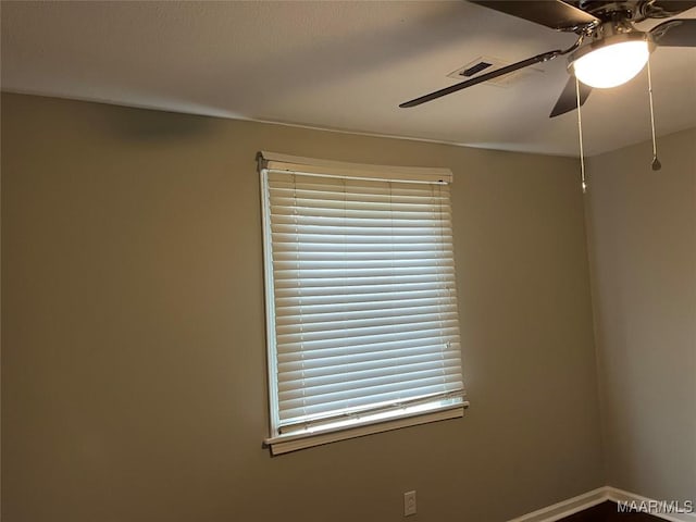 empty room featuring ceiling fan