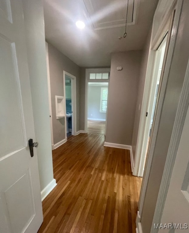 1324 Felder Ave, Montgomery, AL 36106 - hallway with wood finished floors, baseboards, and attic access