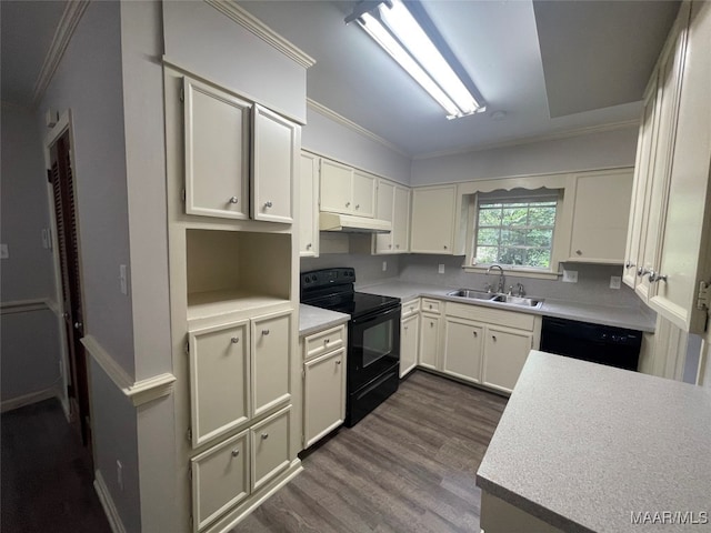 kitchen with ornamental molding, black appliances, sink, and dark wood-type flooring